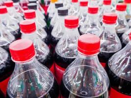 Carbonated soft drink bottles close up photo