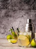 fresh summer caipirinha cocktail on concrete background photo