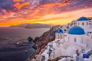 Amazing evening view of Santorini island. Picturesque spring sunset on the famous Oia, Greece, Europe. Traveling concept background. Summer vacation destination