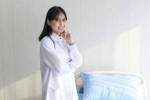 Portrait of young female doctor with stethoscope working at hospital, medical and health care concept photo