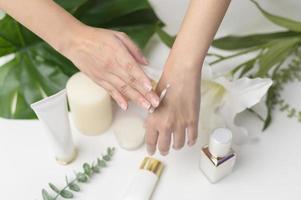 close up hand of applying moisturizing cream, skincare and beauty concept photo