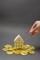 Small white model home with Cryptocurrency bitcoin ,bitcoin mining and financial concept photo