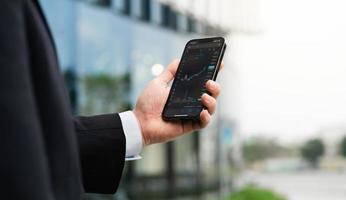 Image of a man holding a mobile phone in his hand photo