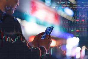 Image of a man holding a mobile phone in his hand photo