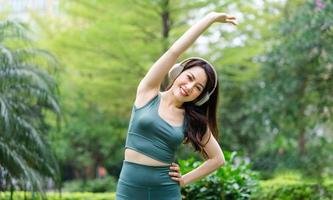 Asian woman exercising at the park photo