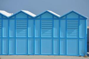 beach cabins on the shore photo