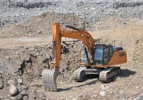 excavator digging a hole photo