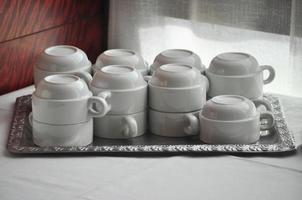 empty tea coffee cups on tray photo