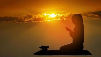 Muslim women dressed in black hijab, praying and praying to Allah Religious rituals for peace photo