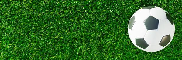 Top View Realistic soccer ball or football ball basic pattern  on  green grass field with sunlight and sunshine. 3d Style and rendering concept for game. Use for background or wallpaper. photo
