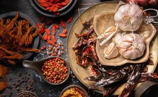 Condiments or spices for red curry or Thai food. Ingredients Food garlic,  Spices Pepper, coriander seeds, dried chilies, turmeric, .