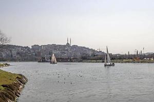 Halic,istanbul,Turkey.March 25,2022.Views from the Golden Horn shore with its green parks, historical and modern buildings.