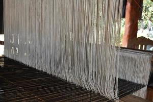 Small weaving looms made from wood used for weaving in rural Thai households. photo