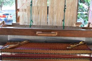 Small weaving looms made from wood used for weaving in rural Thai households. photo