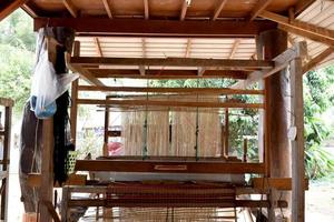 Small weaving looms made from wood used for weaving in rural Thai households.