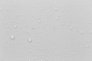 The concept of raindrops falling on a gray background Abstract wet white surface with bubbles on the surface Realistic pure water droplet water drops for creative banner design photo