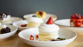 Japanese-style pancakes on a wooden table are ready to serve. photo