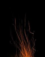 fire flames with sparks on a black background photo