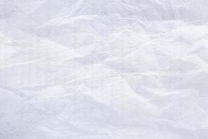 Close-up background of white abstract shockproof foam texture. photo