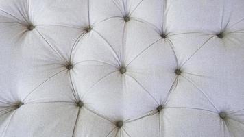 Cloth buttons decorated on the sofa. photo