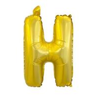 Golden H-shaped balloon isolated on a white background. photo