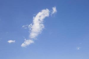 Cloudy sky on a bright blue day background. photo