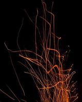 fire flames with sparks on a black background photo