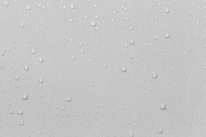 el concepto de gotas de lluvia que caen sobre un fondo gris superficie blanca húmeda abstracta con burbujas en la superficie gotas de agua de gotas de agua pura realistas para el diseño creativo de pancartas
