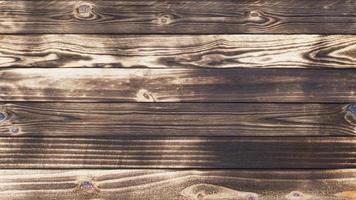 Old wood floors with traces of burnt black on abstract backgrounds and textures. photo