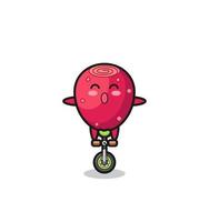The cute prickly pear character is riding a circus bike vector