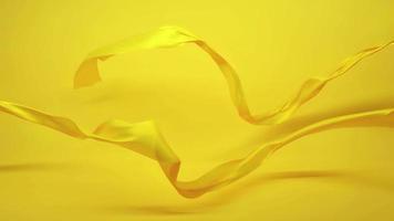 Yellow fabric Clothes flowing by wind over yellow background slow motion video