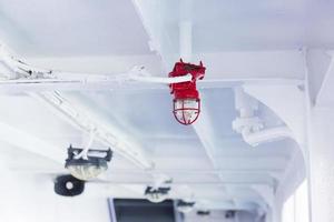 Close-up of red light bulbs on the ship's ceiling. photo