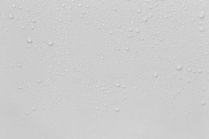 The concept of raindrops falling on a gray background Abstract wet white surface with bubbles on the surface Realistic pure water droplet water drops for creative banner design photo