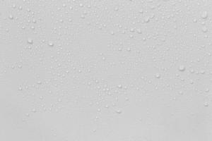 The concept of raindrops falling on a gray background Abstract wet white surface with bubbles on the surface Realistic pure water droplet water drops for creative banner design photo