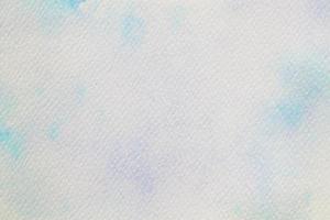 Blue watercolor on white paper, abstract background photo