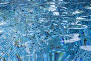 water in swimming pool rippled water detail background photo