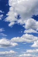 clear blue sky with plain white cloud with space for text background. The vast blue sky and clouds. blue sky background with tiny clouds nature. photo