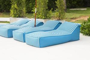Blue cloth bed for sunbathing photo