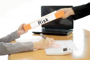 Businesswoman sends the debtor document to the businessman. selective focus. photo