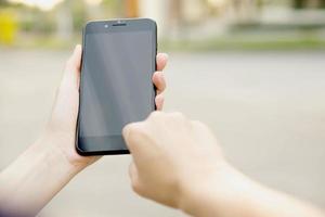 Woman using her Mobile Phone photo