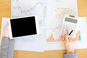 Close-up Of Businesswoman With Digital Tablet And Document photo