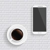 Coffee and smartphone on the table. Top view desktop.