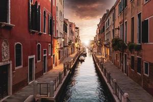 Scenic colorful Venice streets near landmark Rialto Bridge in historic city center photo
