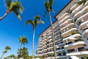 Luxury condominiums and apartments on Playa De Los Muertos beach and pier close to the famous Puerto Vallarta Malecon, the city largest public beach photo
