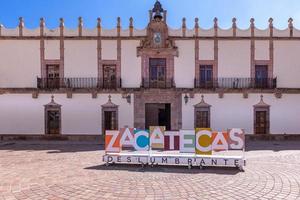 Colorful old city streets in historic city center of Zacatecas near central cathedral. It is a popular mexican tourism destination photo