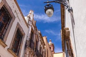 Colorful old city streets in historic city center of Zacatecas near central cathedral. It is a popular mexican tourism destination photo