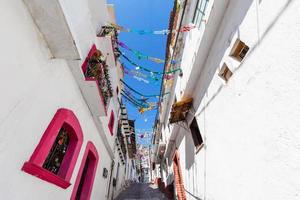 Mexico, Scenic Taxco colonial architecture and cobblestone narrow streets in historic city center near Santa Prisca church photo