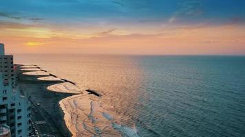 Colombia, scenic view of Cartagena beaches and playas at sunset near historic city center and resort hotel zone photo