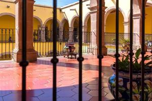 Central Mexico, Aguascalientes colorful streets and colonial houses in historic city center near Cathedral Basilica, one of the main city tourist attractions photo