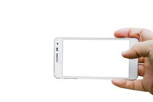 Hand holding smartphone blank screen taking photo